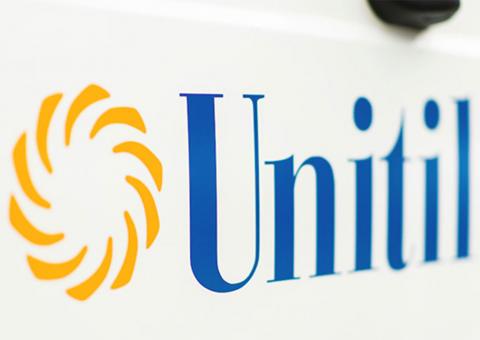 close up of Unitil logo on side of truck