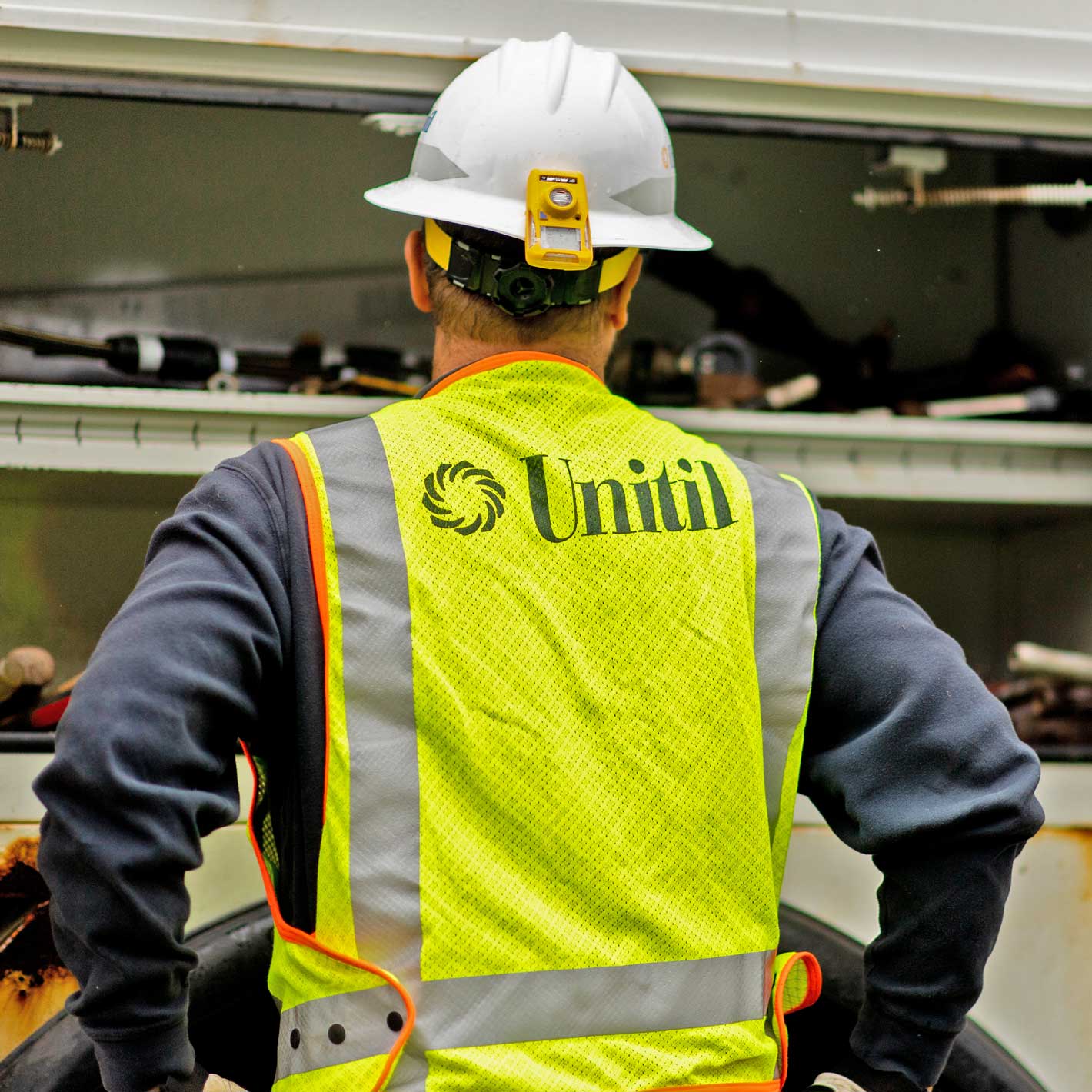 Closeup of Unitil logo on a reflective safety vest.