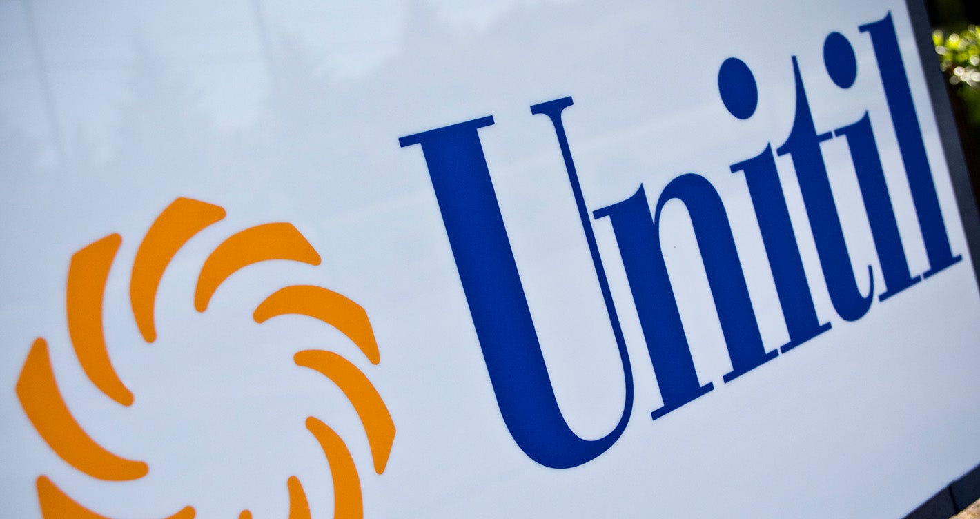 Closeup angle of large Unitil logo on an exterior sign