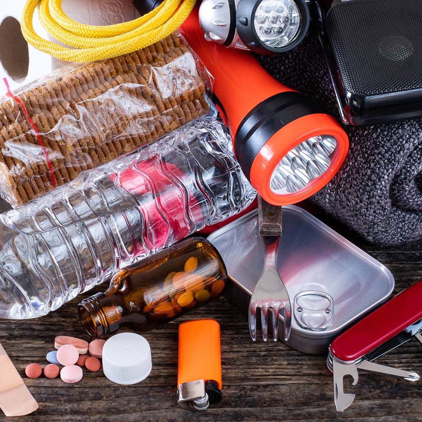 emergency preparedness items scattered on table top