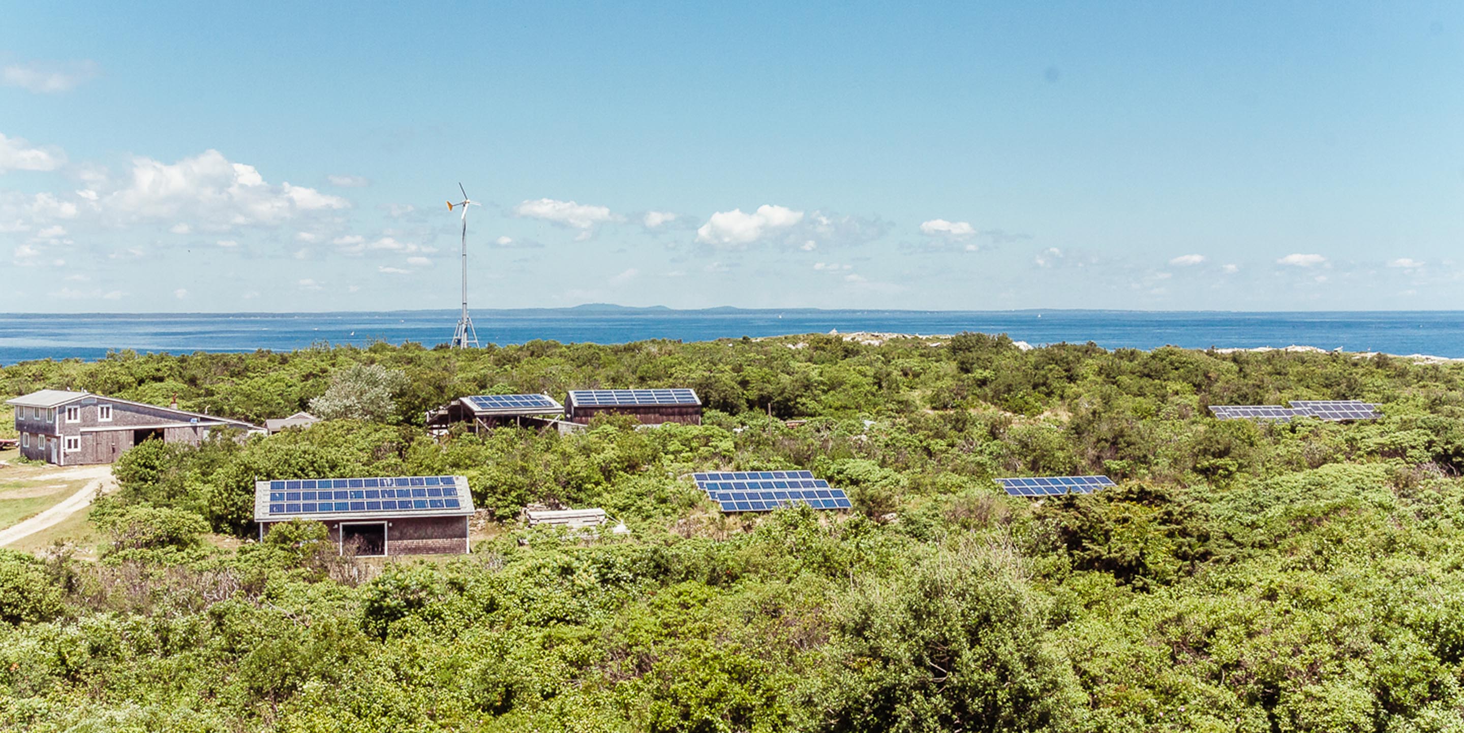aerial view of Shoals Marine lab showing rooftop solar panels amongst the islands vegetation