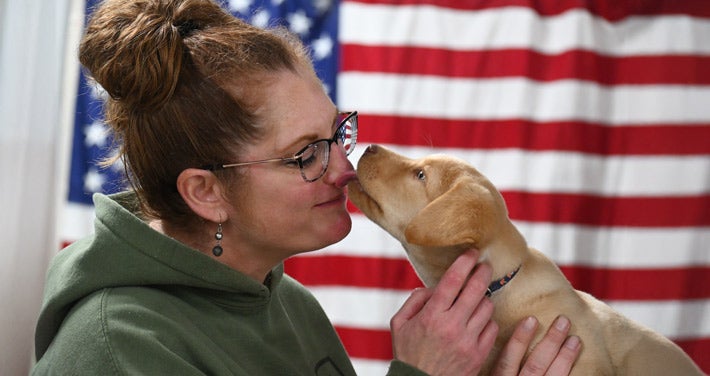 Unitil Employee Volunteer with Hero Pups of Stratham, NH