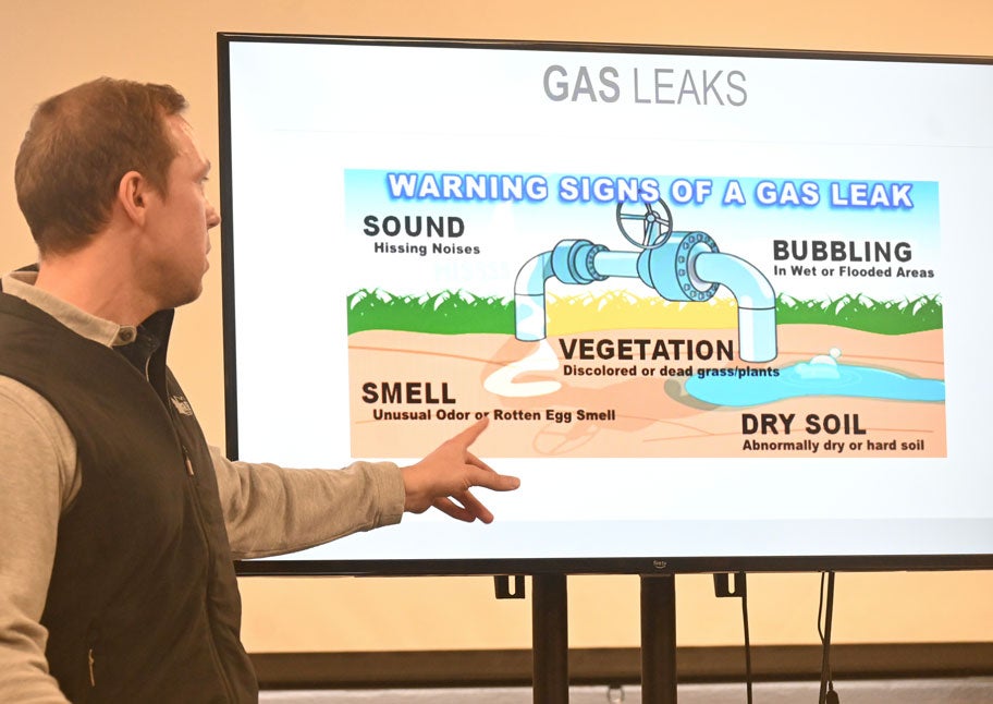 Kyle Bennett, supervisor of Technical Training and Quality Management at Unitil, presents gas leak information.