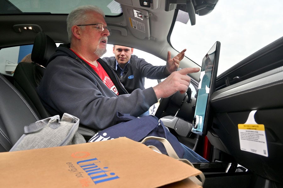 behind the wheel of an EV