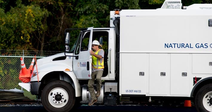 Unitil worker exiting a natural gas truck