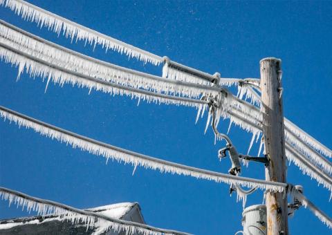 close up view of ice build up on power lines