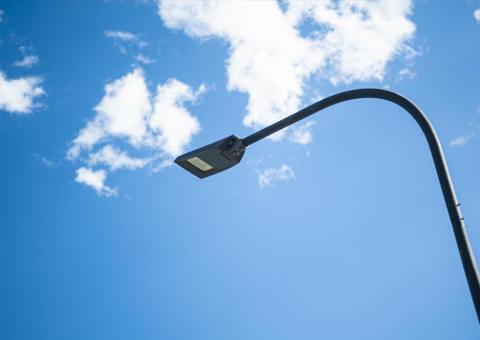 detailed view of street light against blue sky