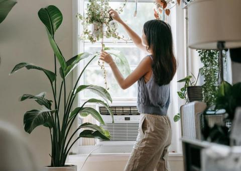 women in home with window air conditioner
